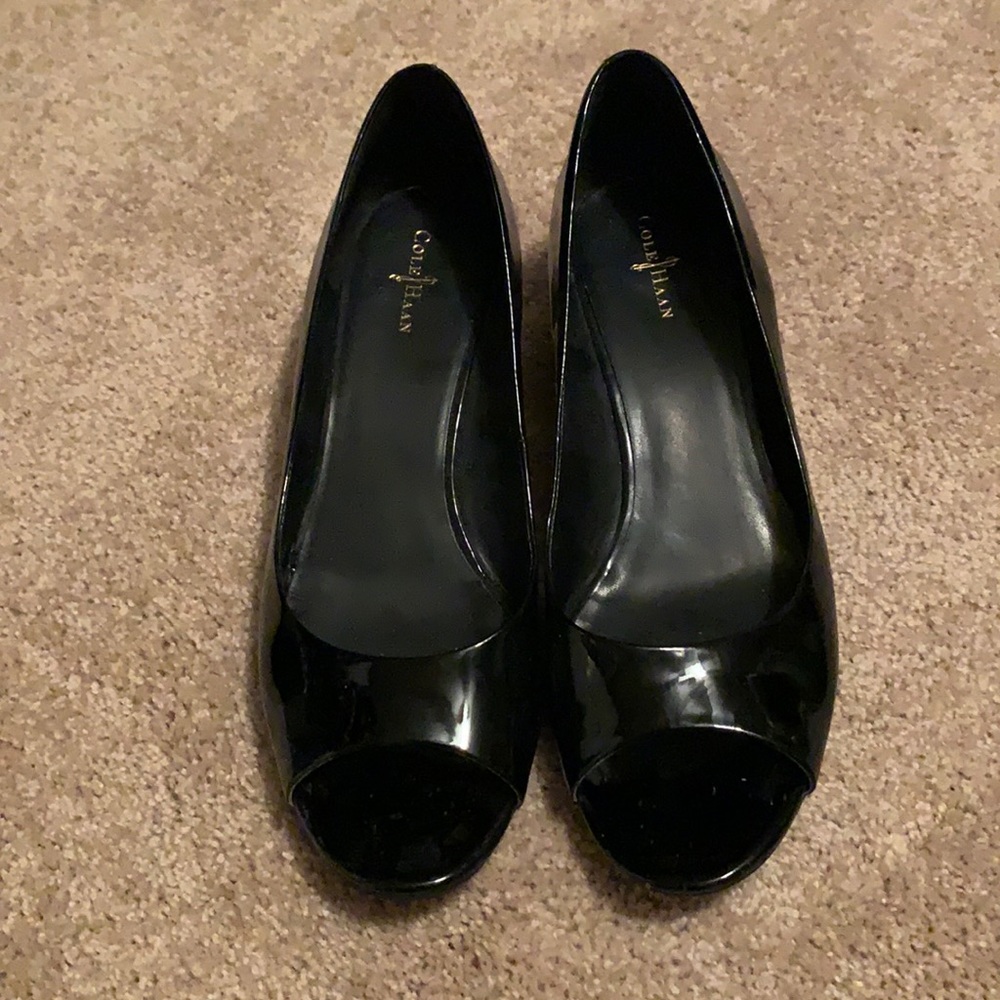 Cole Haan black patent open toe low wedge.